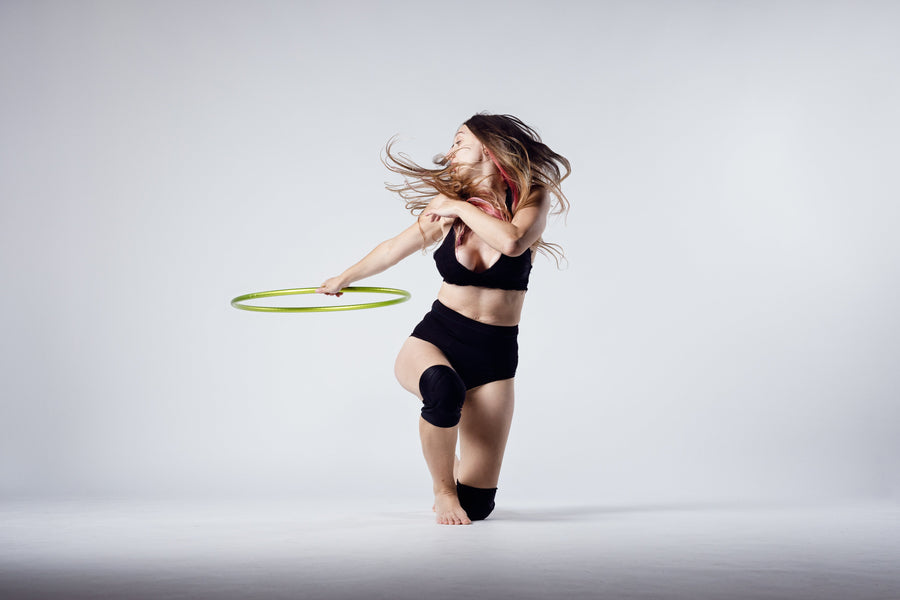 Marianna De Sanctis turning with a green hula hoop – Bubble Bum Banter interview by My Bubble Bum